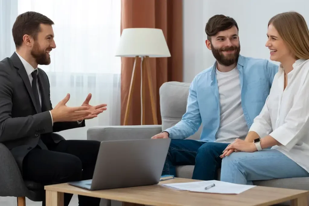 Lawyer consulting with a couple in a modern office setting, discussing family law appeals and legal options in Central East Austin.