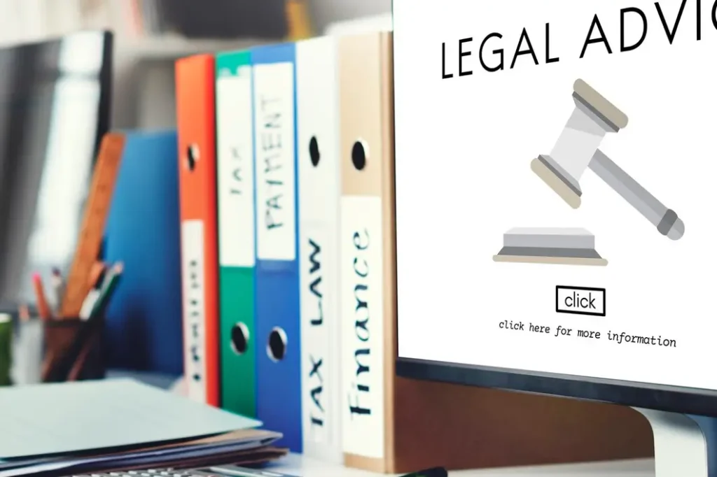 Computer monitor displaying a legal advice graphic featuring a gavel, surrounded by colorful binders labeled with legal topics, emphasizing family law appeals in Collin County.