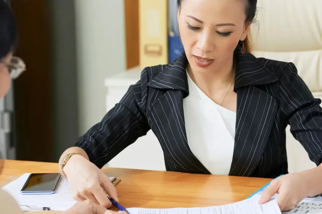 Professional woman reviewing legal documents during a consultation in a family law office, emphasizing the importance of legal guidance in Fort Worth family law appeals.