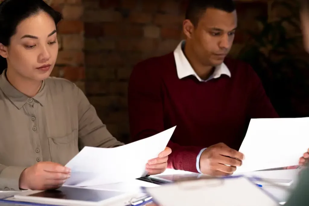 Individuals reviewing legal documents in a consultation setting, emphasizing family law appeals in Tarrytown.