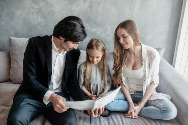 Family discussing legal documents related to custody or family law appeal, seated together on a couch in a modern living room.