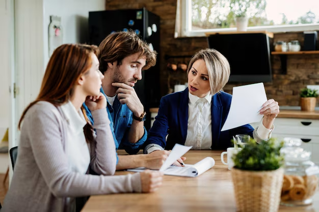 Two clients discussing family law matters with a lawyer in an office setting, reviewing documents related to legal appeals in McQueeney, Texas.